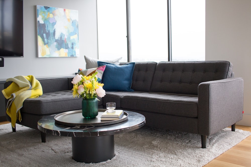 a living room filled with furniture and a large window