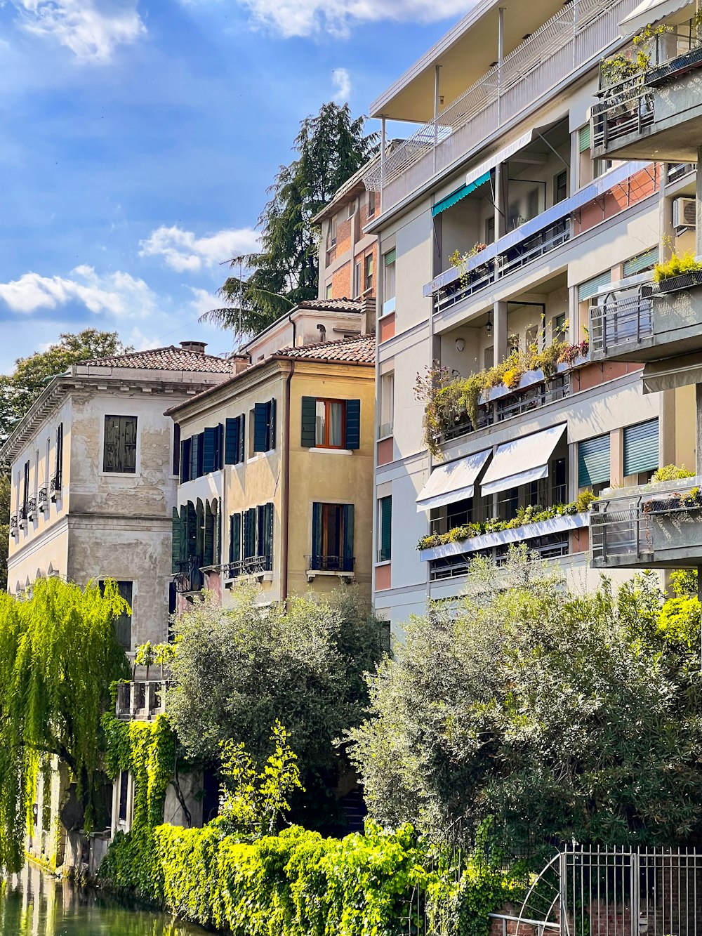 a row of buildings next to a body of water