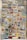 A collection of various vintage pins is displayed on a corrugated cardboard backdrop. The pins feature a variety of designs including cars, animals, flags, logos, and symbols. The pins are colorful and arranged in a somewhat random order, covering most of the cardboard surface.