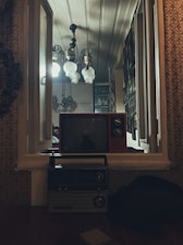 A warm, vintage-style living room with a classic movie poster on the wall and a retro TV playing a black-and-white film.