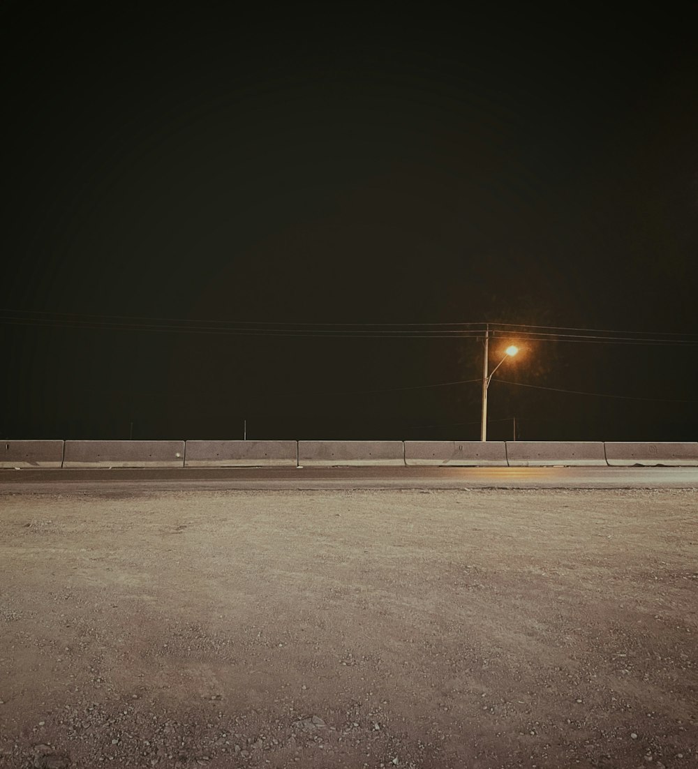 a street light sitting on the side of a road