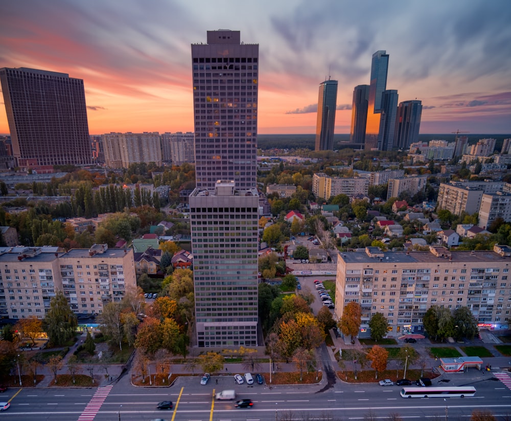 an aerial view of a city at sunset