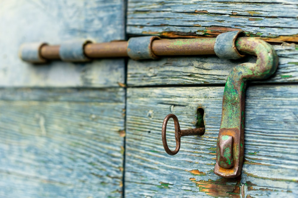 a close up of a door with a rusty handle