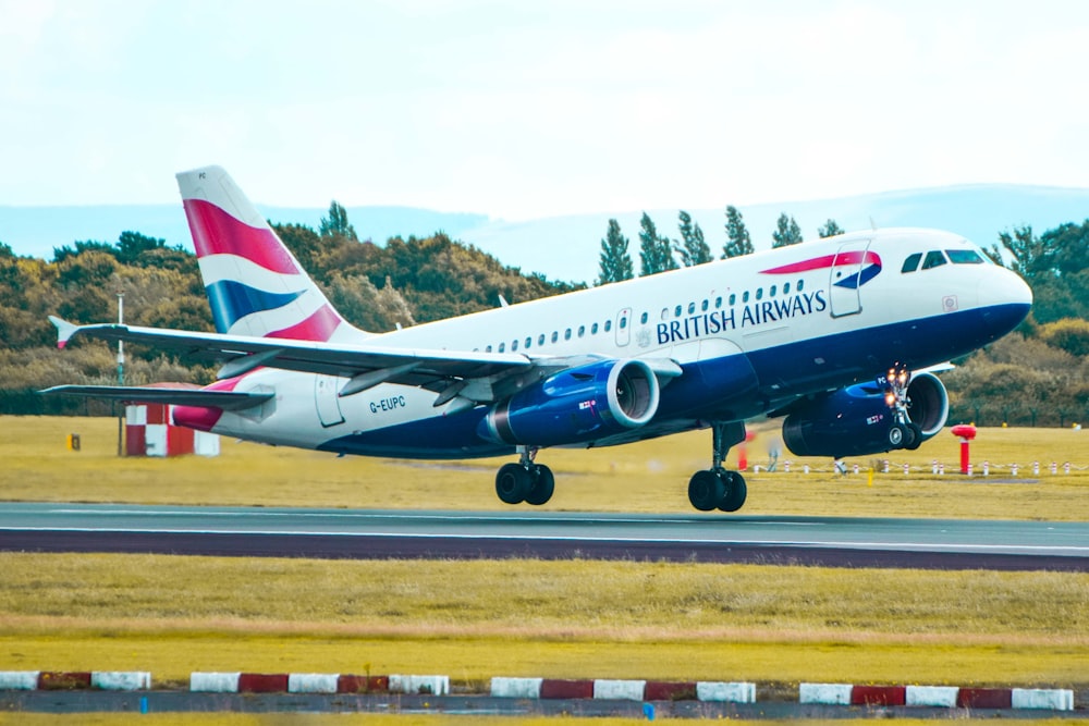 a british airways plane taking off from an airport runway