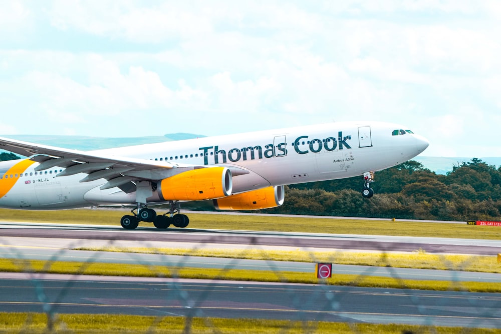 a large jetliner taking off from an airport runway