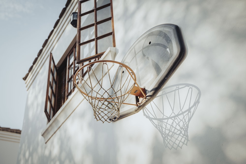 a basketball going through the hoop of a basketball hoop