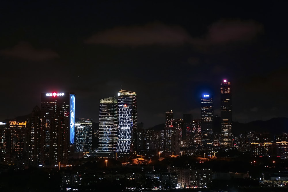 a night view of a city with a lot of tall buildings