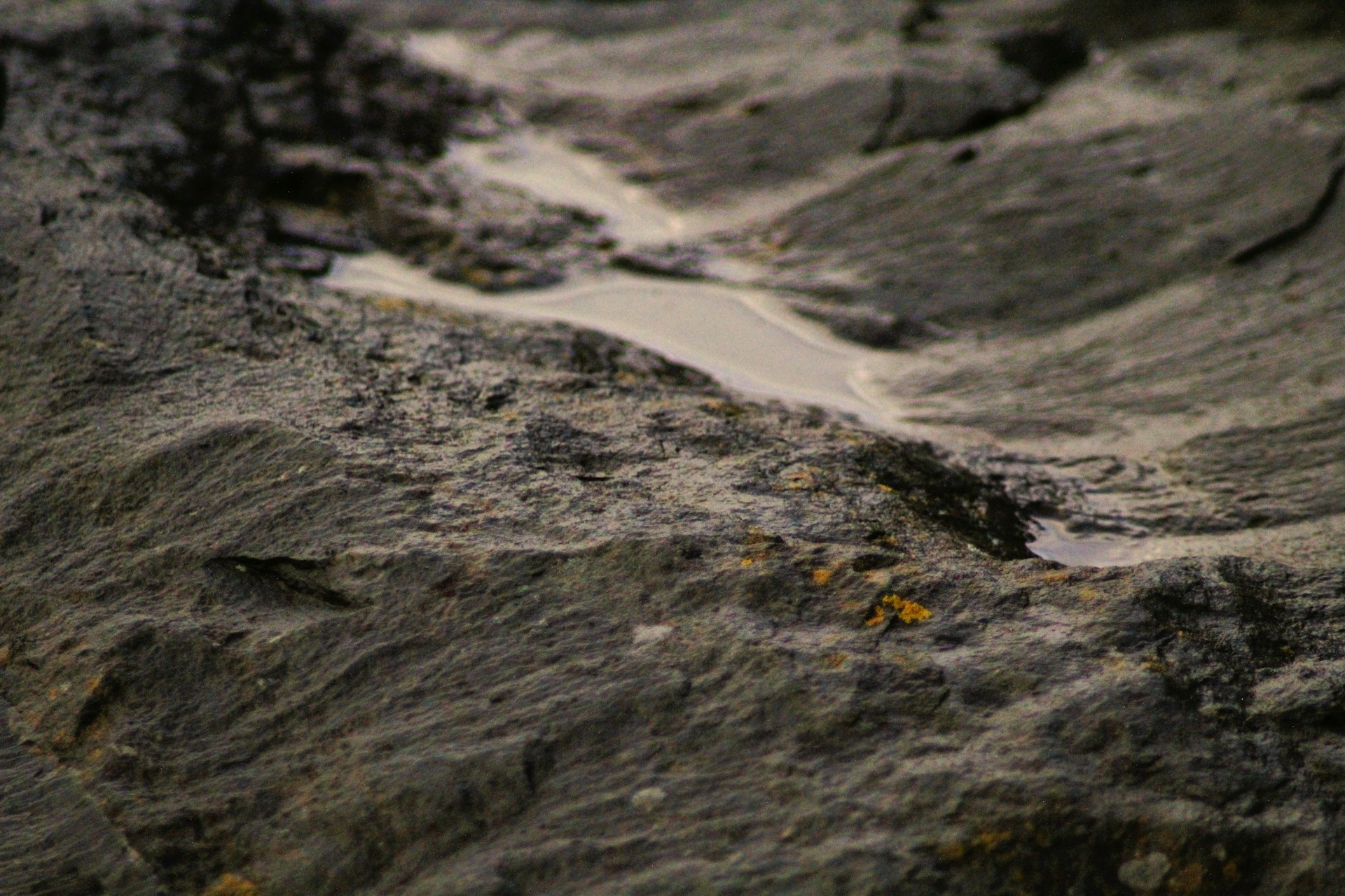 a close up of rocks with water running down them