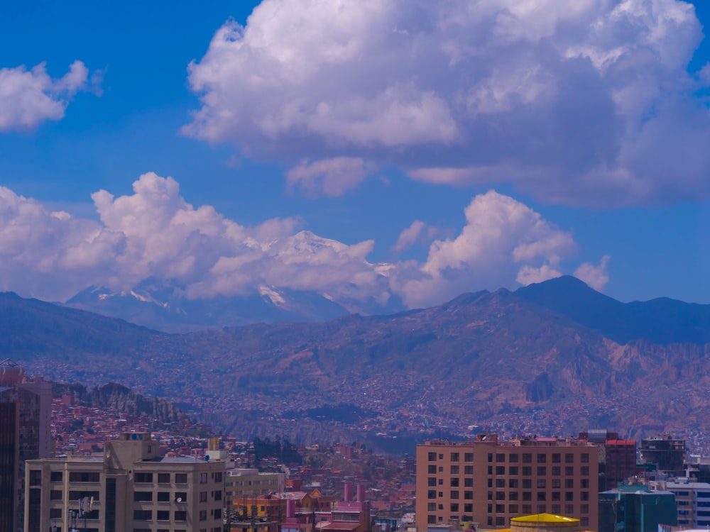 a view of a city with mountains in the background