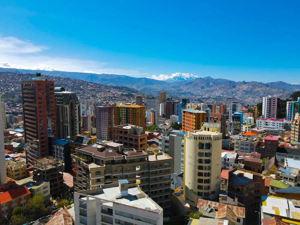 a view of a city with mountains in the background