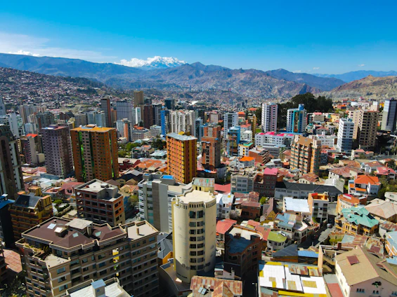 A vibrant cityscape of Manila showcasing modern buildings and bustling business districts under a clear sky.
