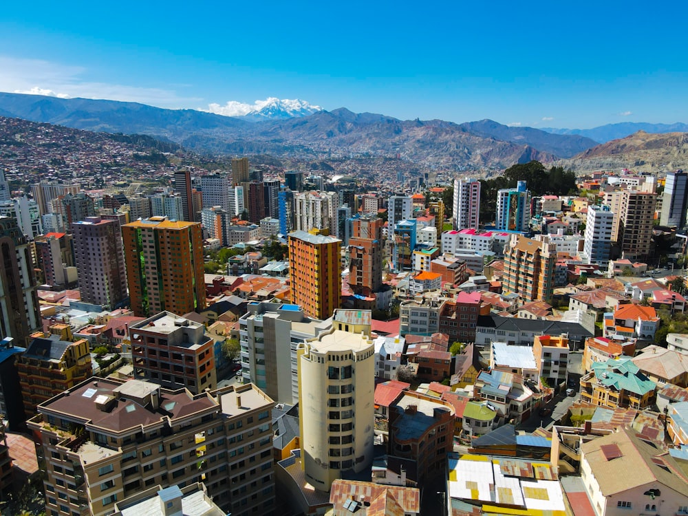 a view of a city with mountains in the background