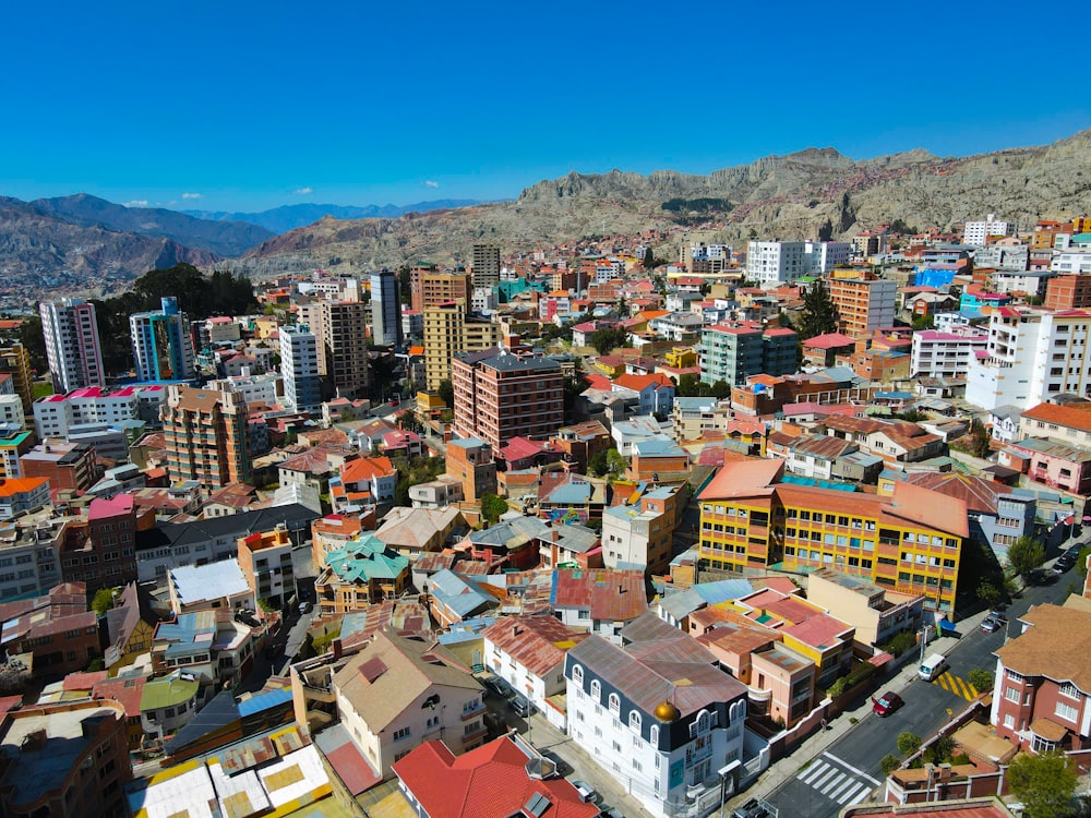 a view of a city with mountains in the background