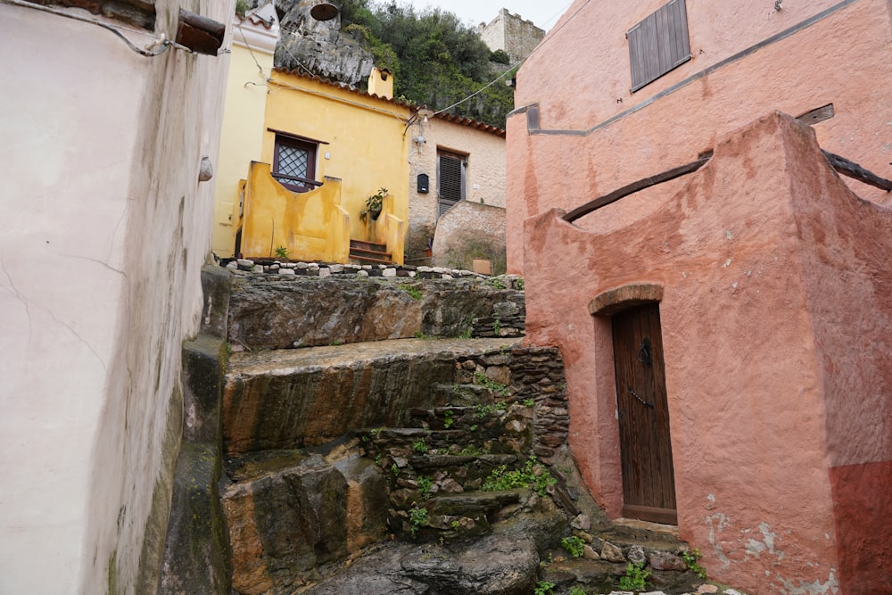 a narrow alleyway with steps leading up to a building