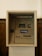 An ATM machine embedded in a wall, featuring a screen, card slot, keypad, and cash dispenser. The surrounding surface is tiled and the machine has a 'ATMANDIRI' logo displayed prominently.