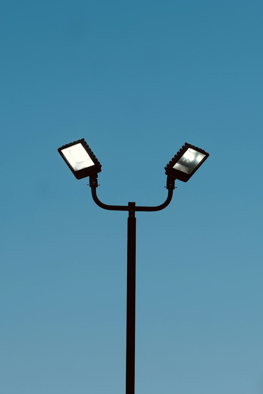 a street light with two lights on top of it