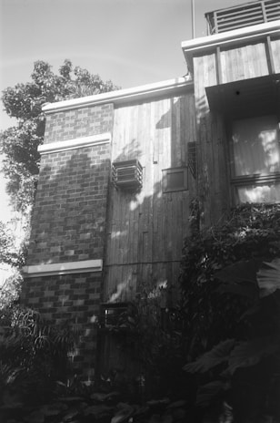 a black and white photo of a brick building