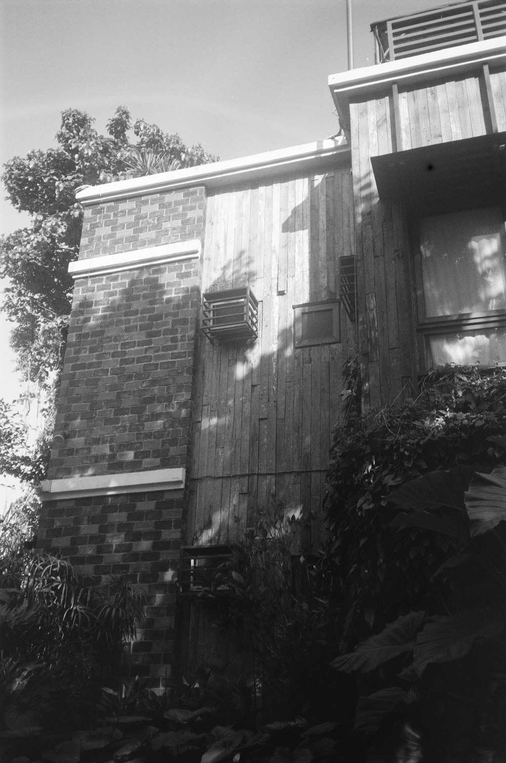 a black and white photo of a brick building