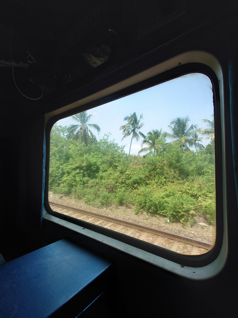 a view from inside a train looking out the window