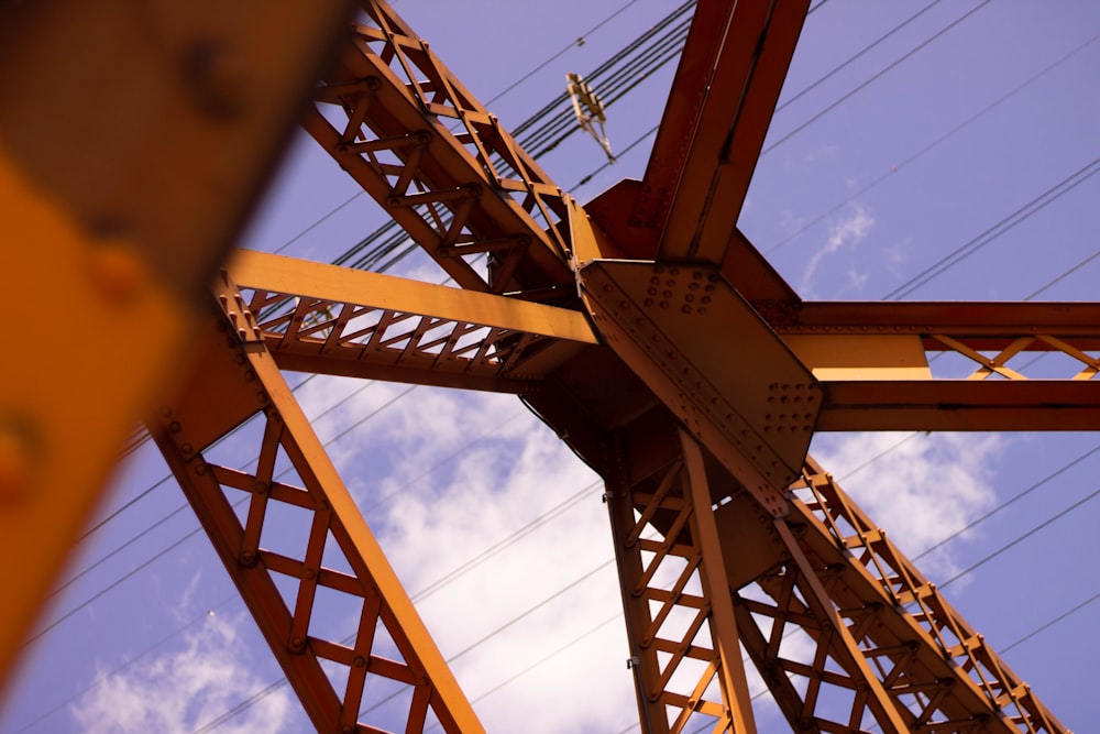 a large metal structure with a sky in the background