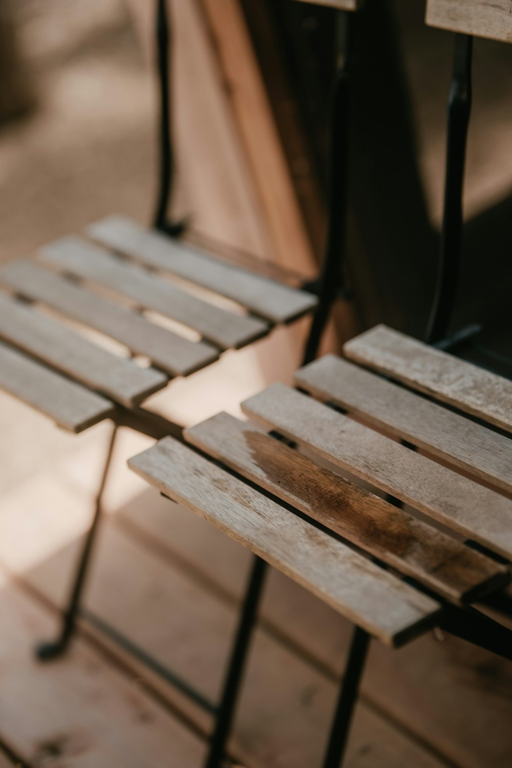 a couple of wooden chairs sitting next to each other