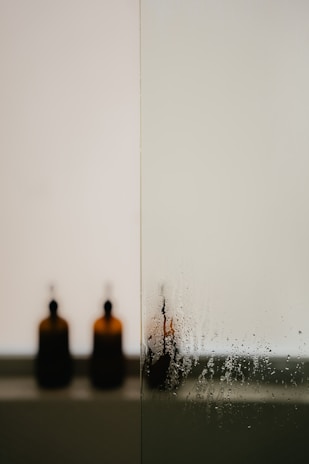A serene image of water with a glass, symbolizing purity and cleansing.