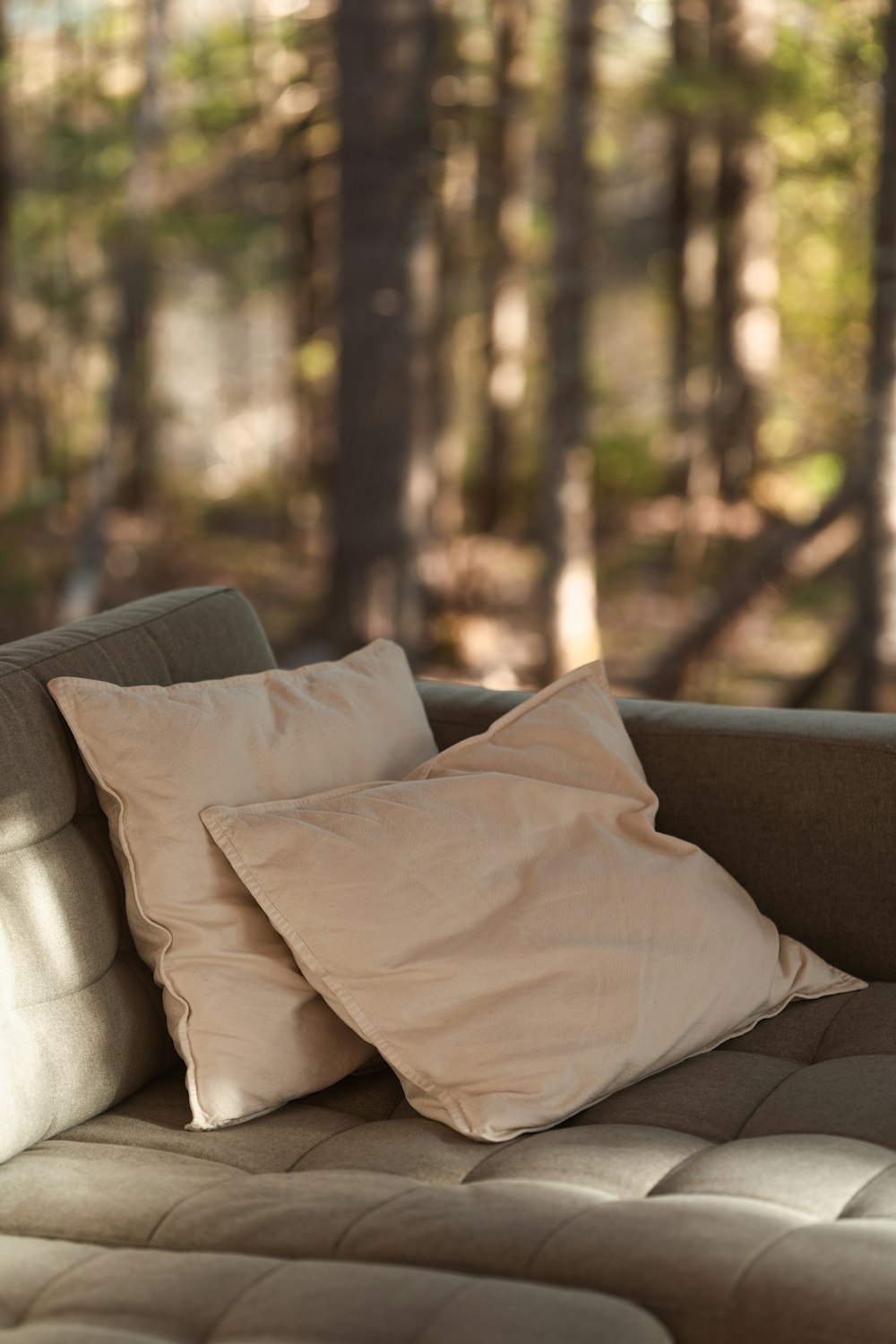 a couch with two pillows on top of it