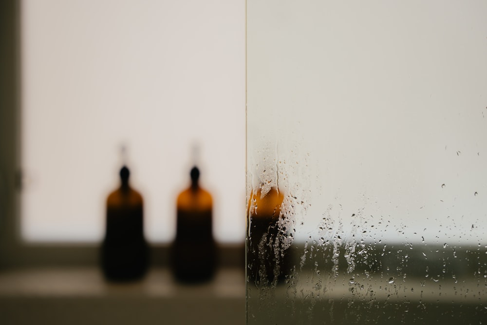 three brown bottles sitting on top of a counter