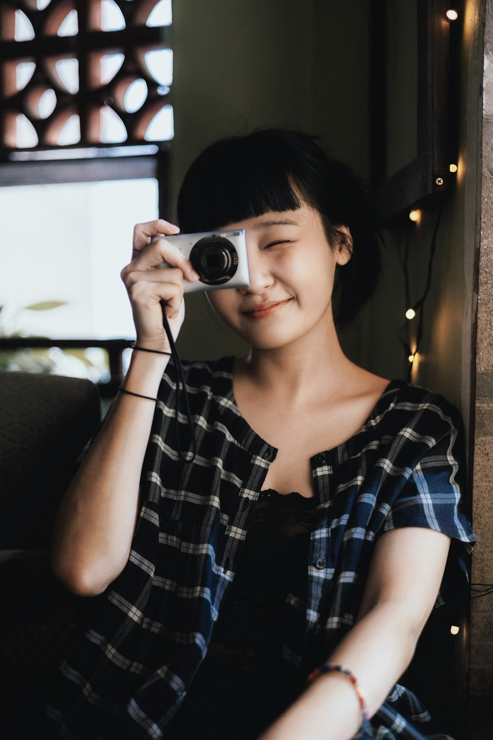 a woman taking a picture with a camera