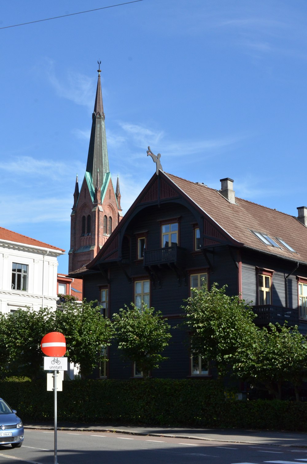 a black house with a steeple and a steeple on top