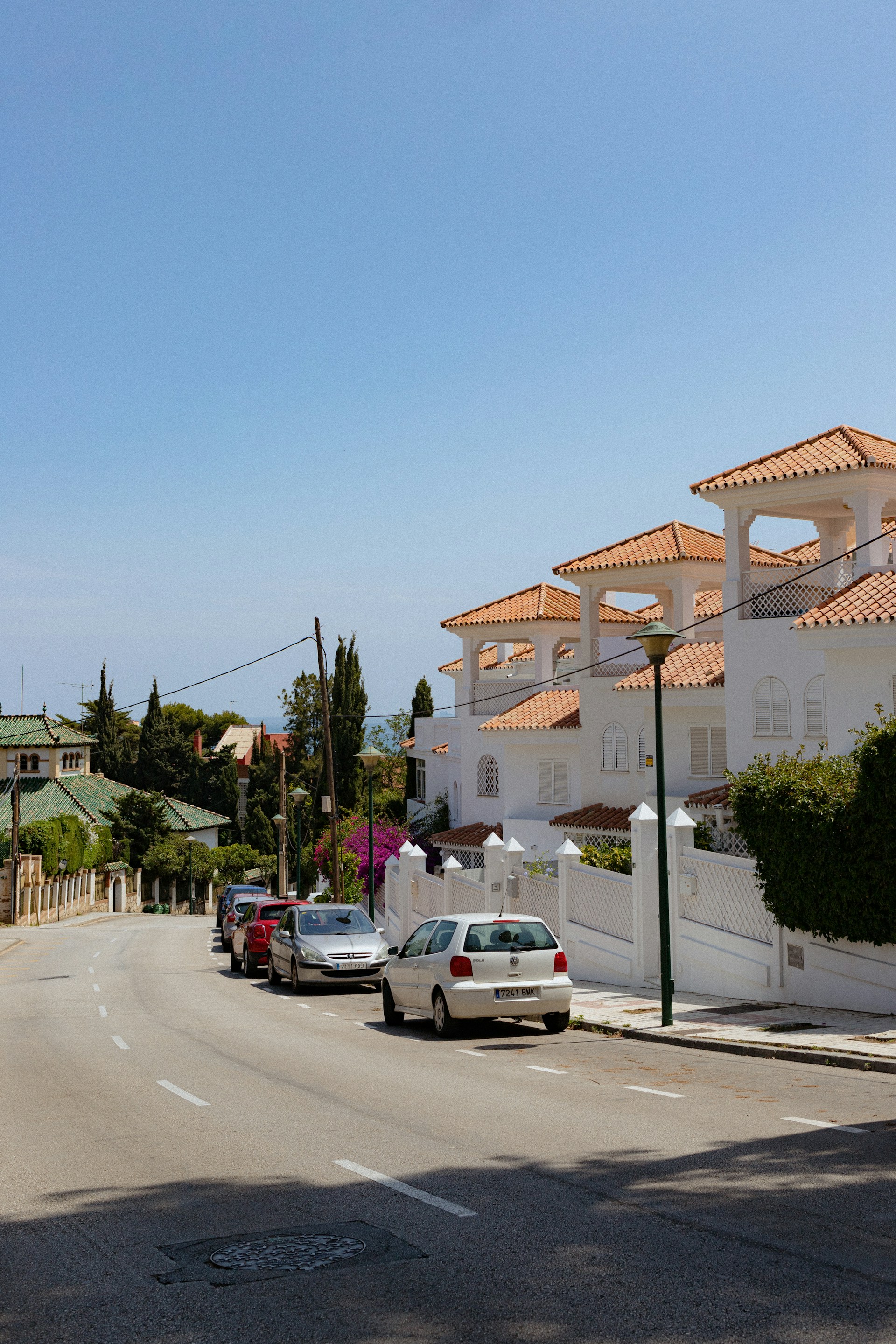 a street with cars parked on the side of it