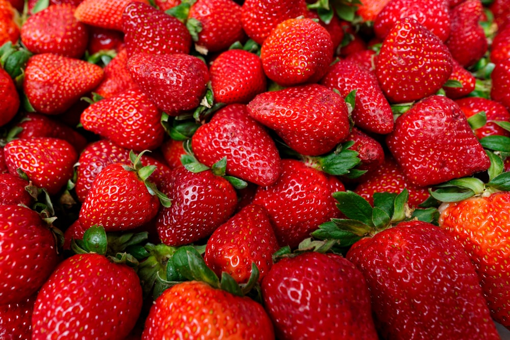 a close up of a bunch of strawberries