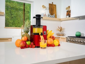 A modern robotic juicer in action, preparing fresh juice.