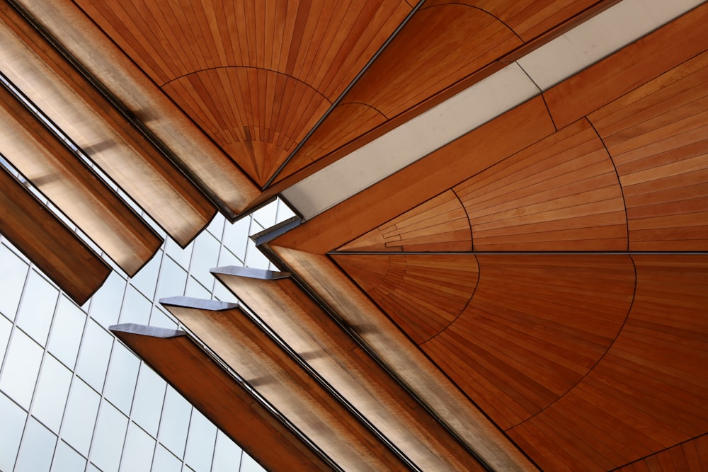 a close up of a wooden ceiling with a sky background