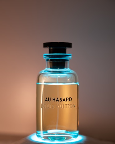 a bottle of perfume sitting on top of a table