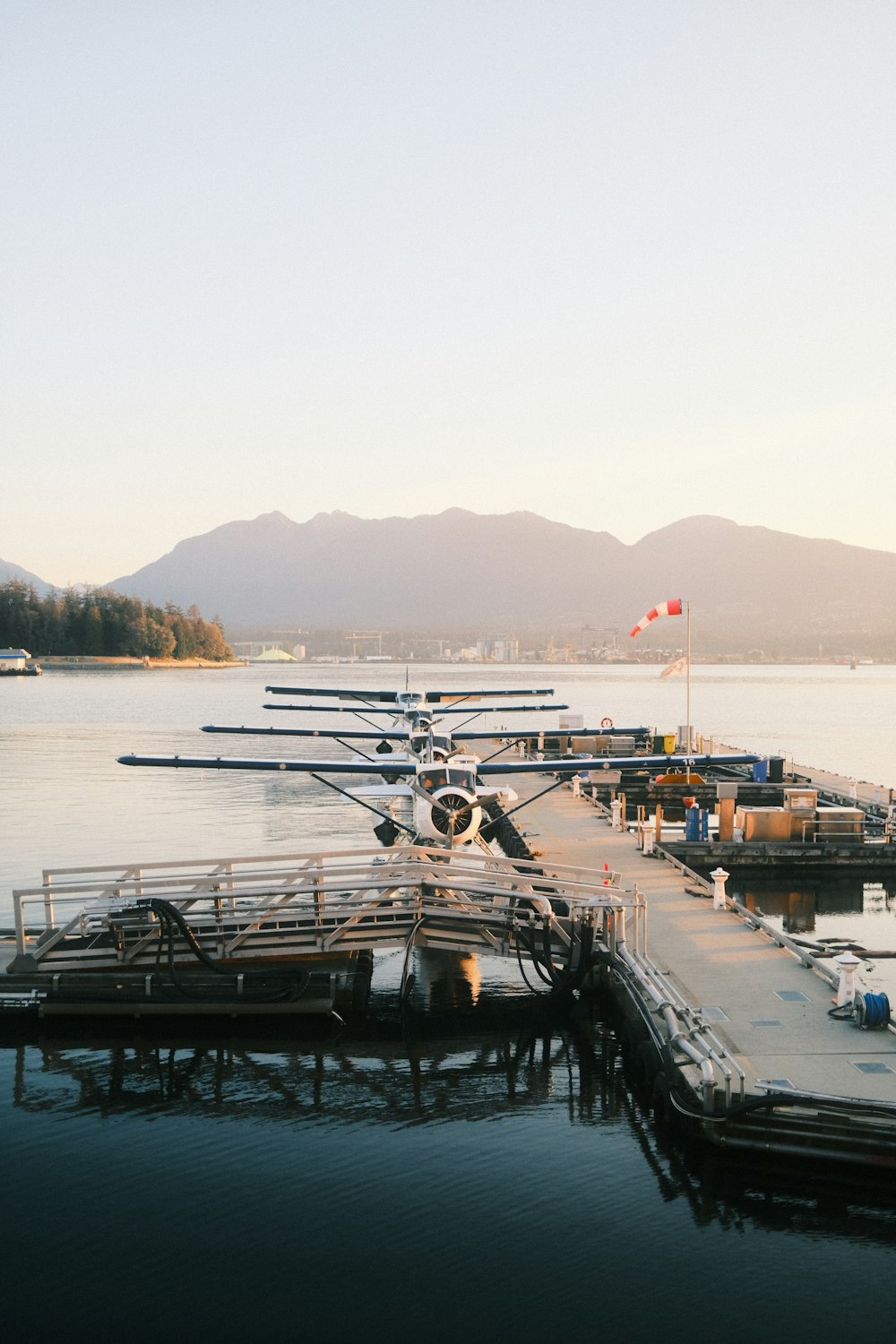 a small plane is parked at a dock