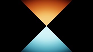 an orange and blue triangle on a black background