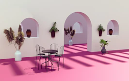 A beautifully decorated reception area featuring magenta accents and minimalist floral arrangements.