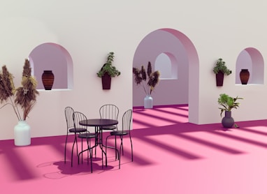 a room with a table and chairs and potted plants