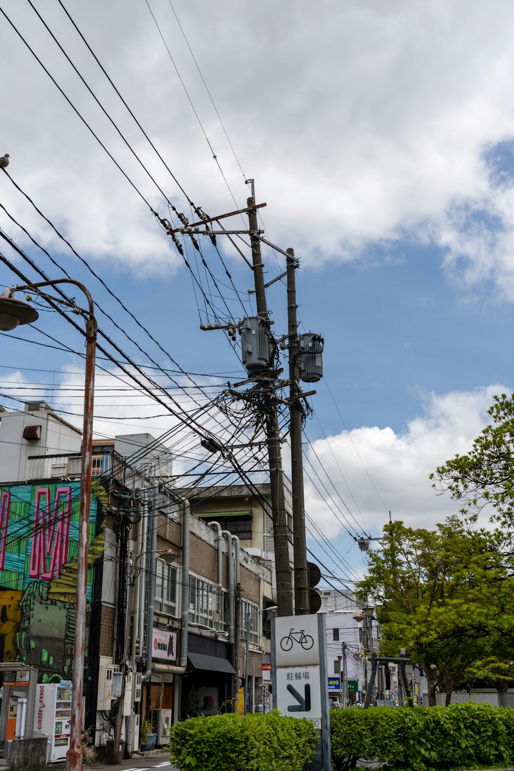 a street with a bunch of power lines above it