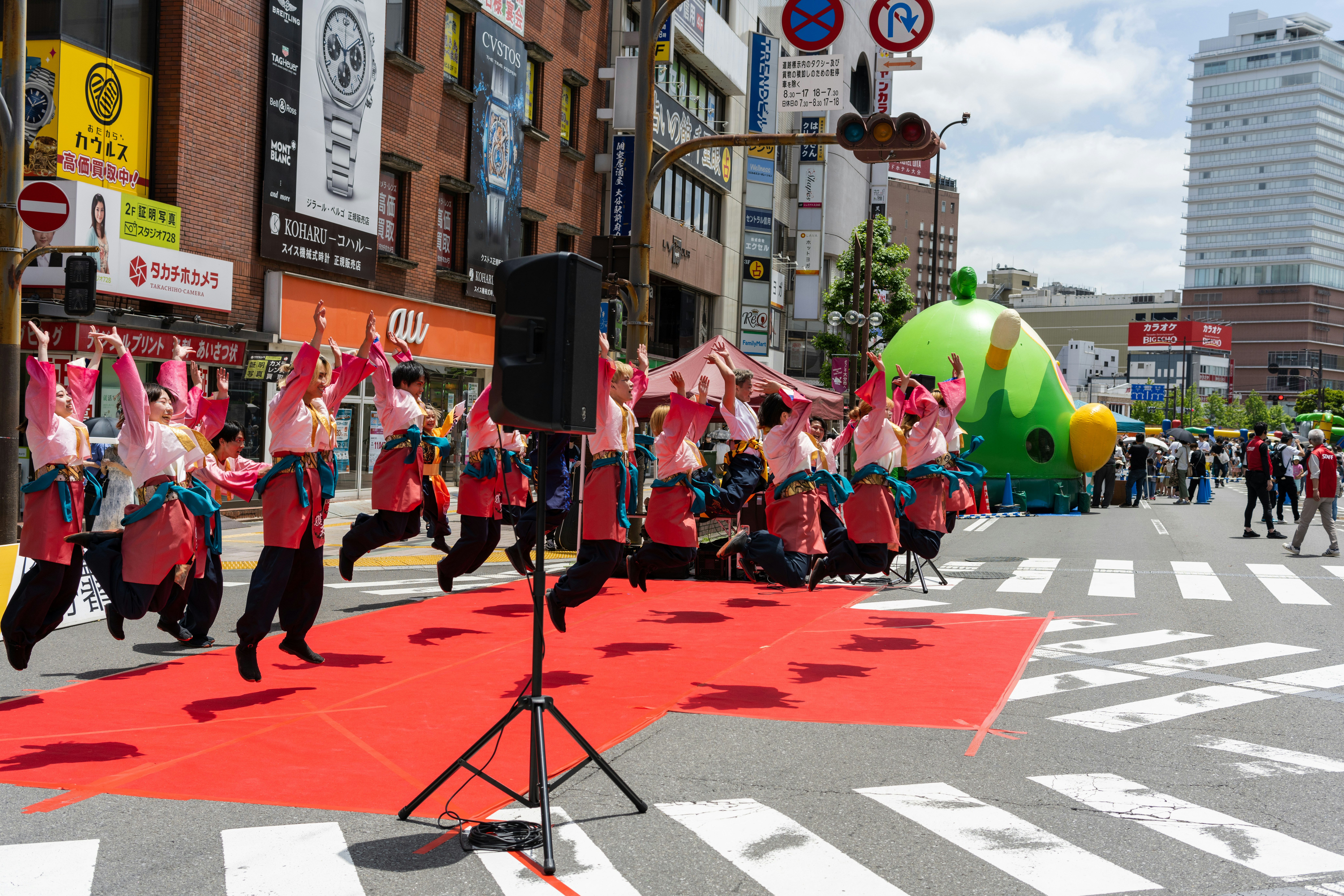a group of people walking down a street