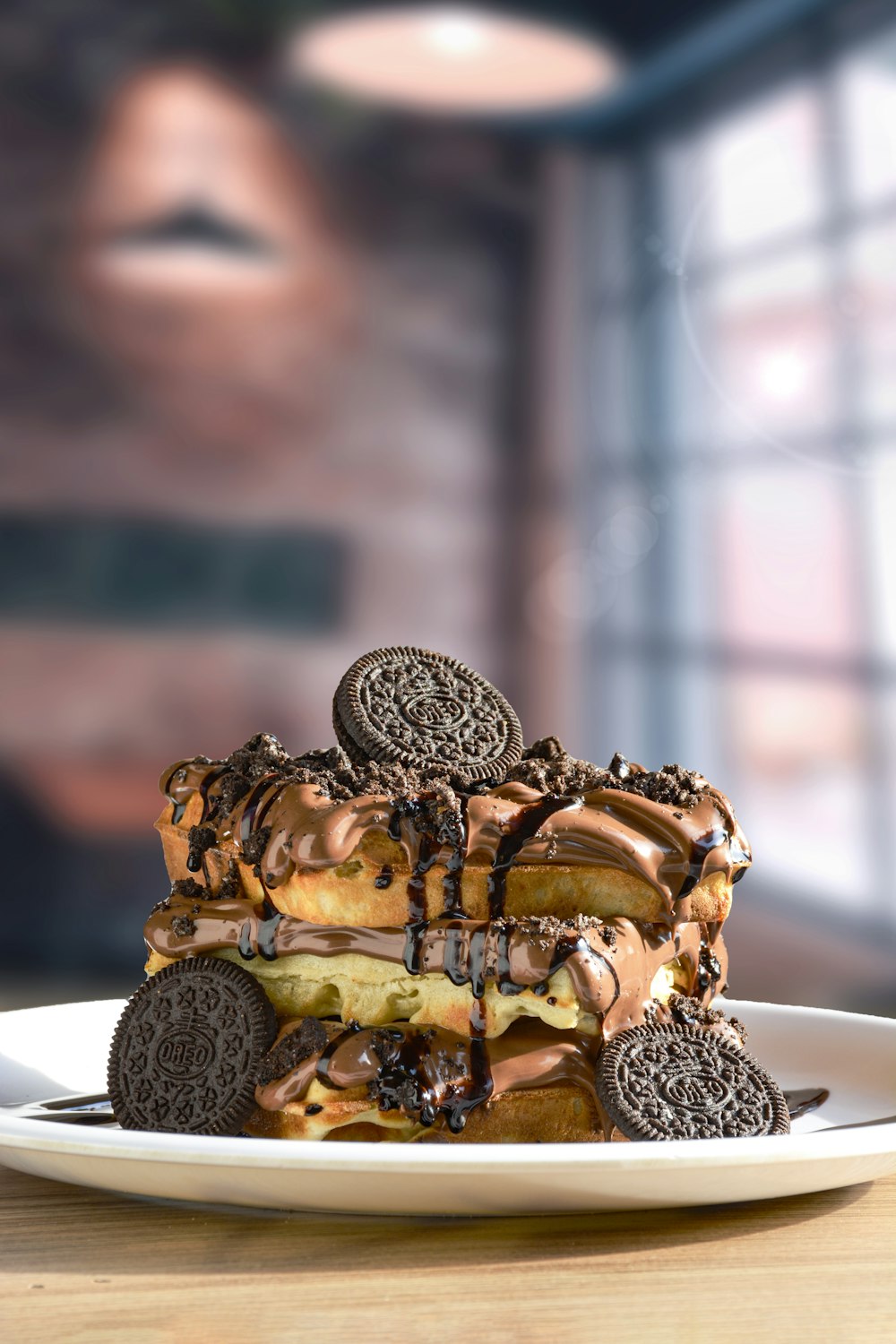 a white plate topped with a stack of cookies and oreo cookies