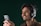 Close-up of a customer service representative smiling while using a headset.