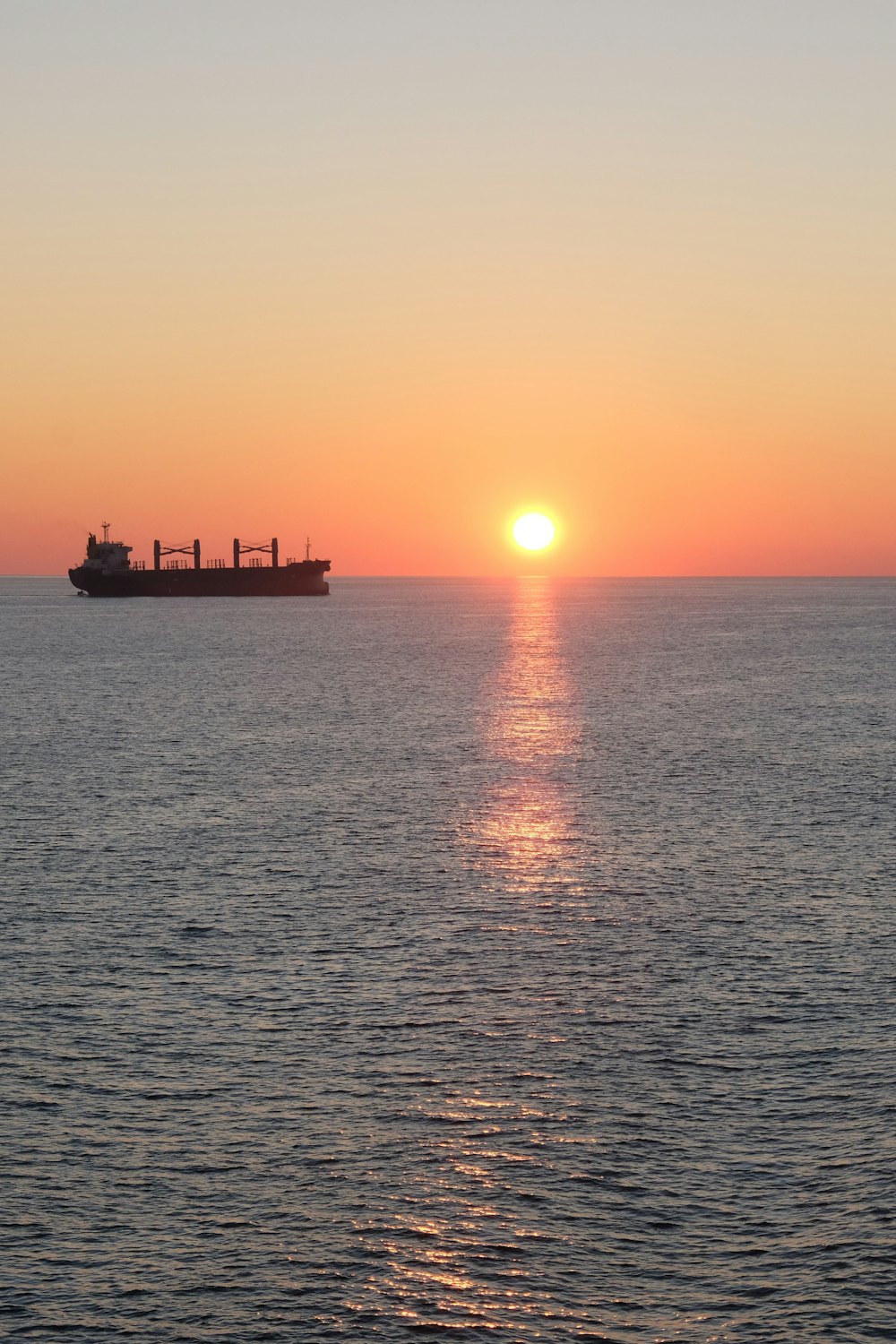 a large cargo ship sailing across a large body of water