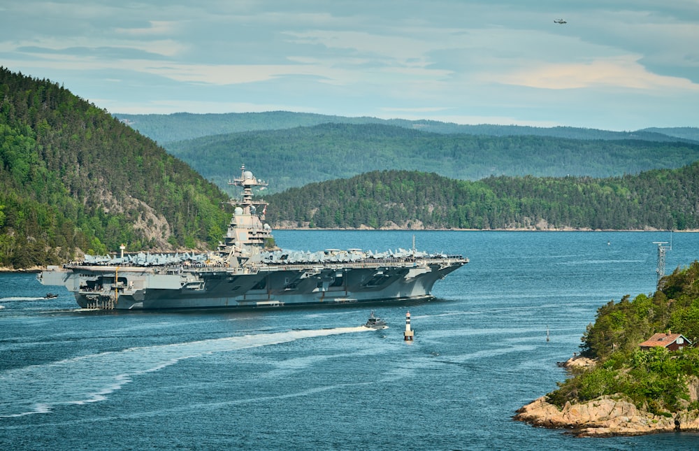 a large military ship in the middle of a body of water