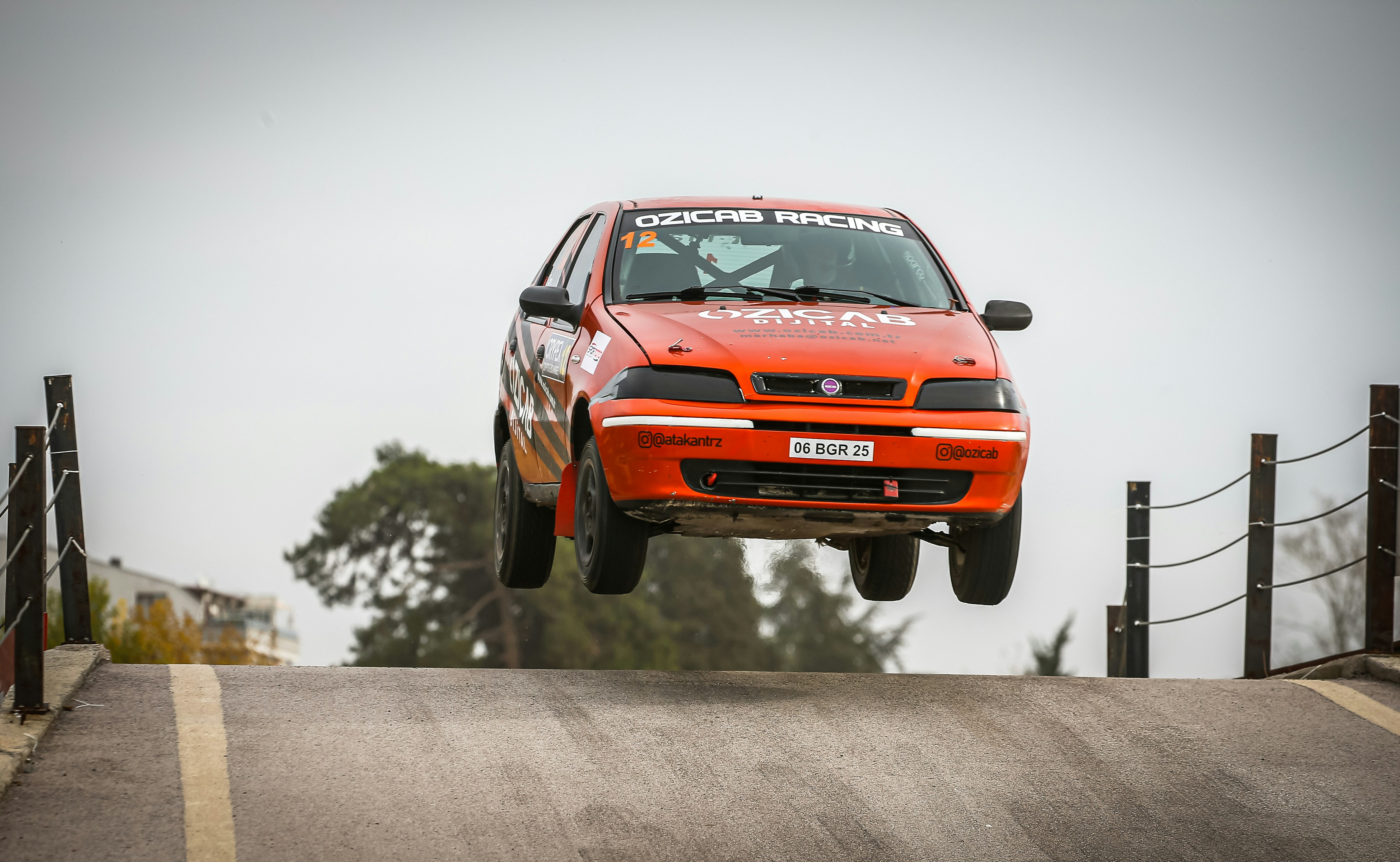 a red car is jumping in the air