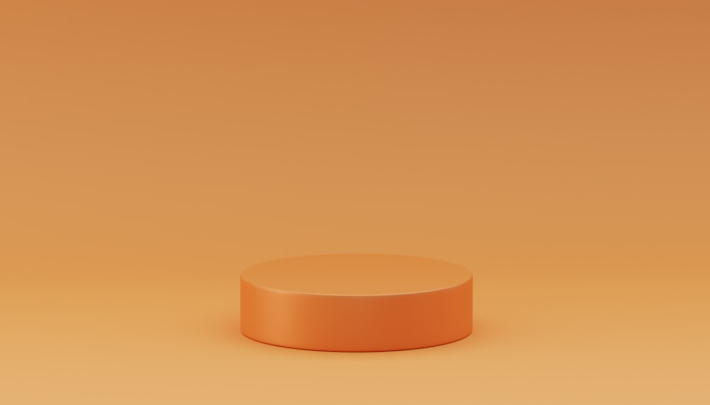 a small round object on an orange background