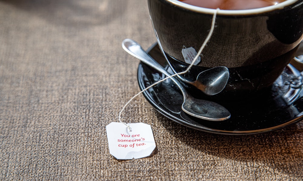 a cup of tea with a tag on it