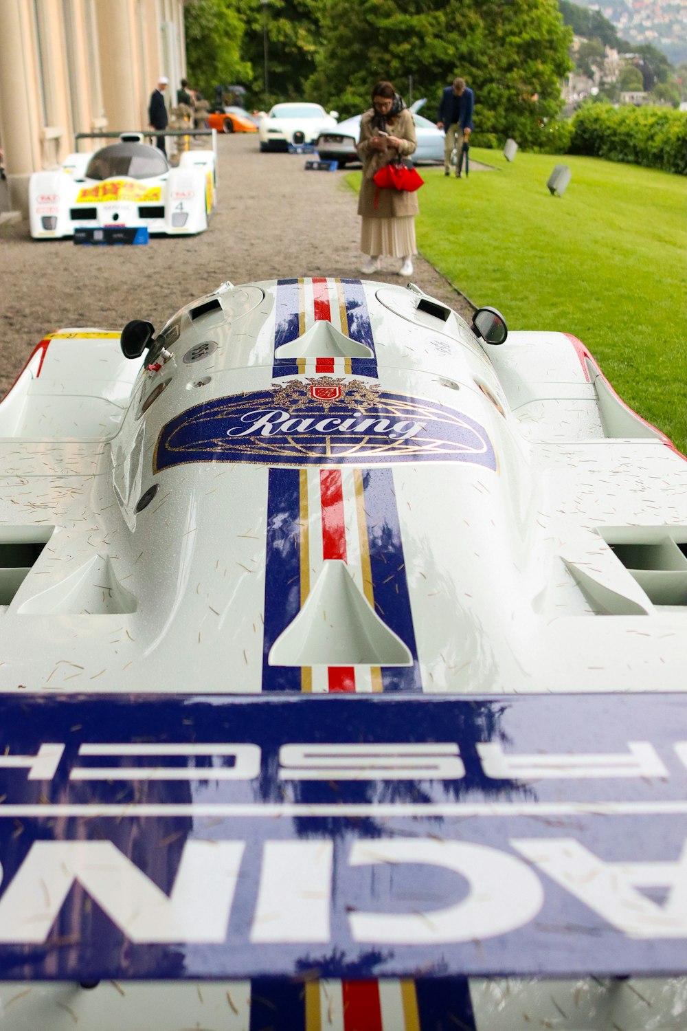 a race car parked in front of a building