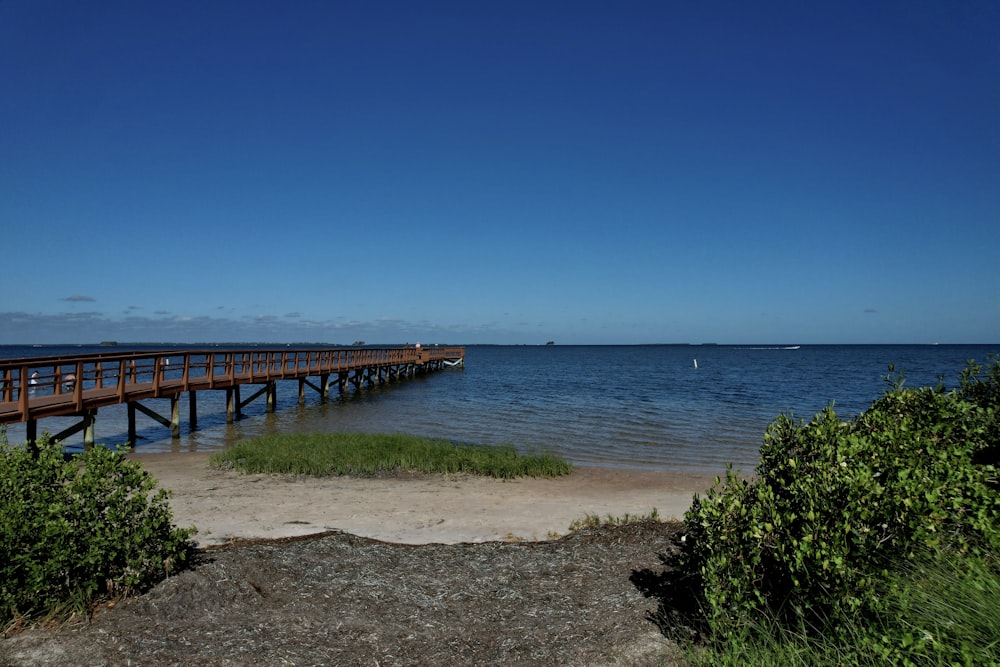 a long wooden bridge over a body of water